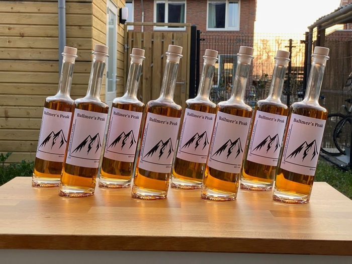A row of 8 bottles of Ballmer's Peak